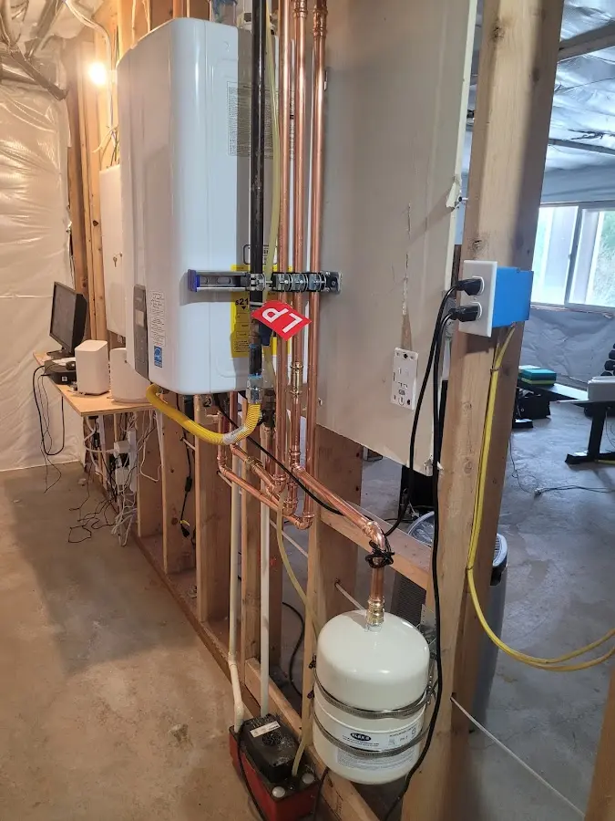 Licensed plumber repairing a kitchen sink in Ravenna